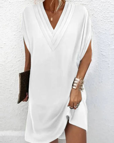 Robe élégante unie avec des manches à ouvertures