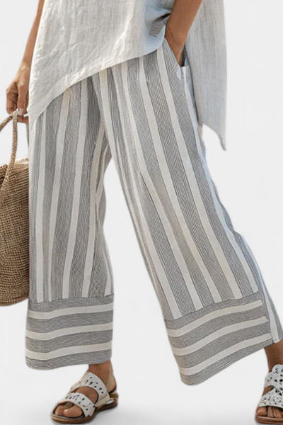 Ensemble Daisy de Blouse Asymétrique et Pantalons Rayés pour un Style Moderne et Élégant