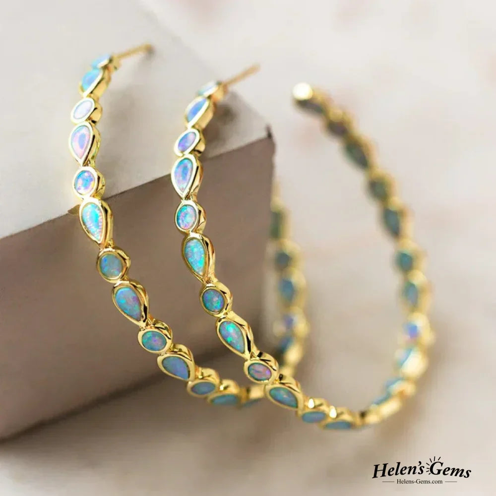 Boucles d'oreilles créoles en or avec opale bleue vintage